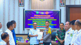 James Uang melakukan melakukan penandatanganan NPHD bersama TNI/POLRI, || Foto: Istimewa