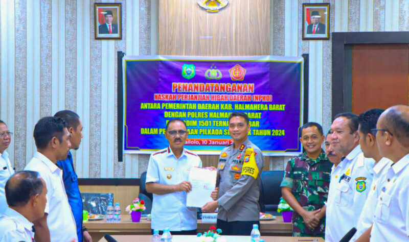 James Uang melakukan melakukan penandatanganan NPHD bersama TNI/POLRI, || Foto: Istimewa